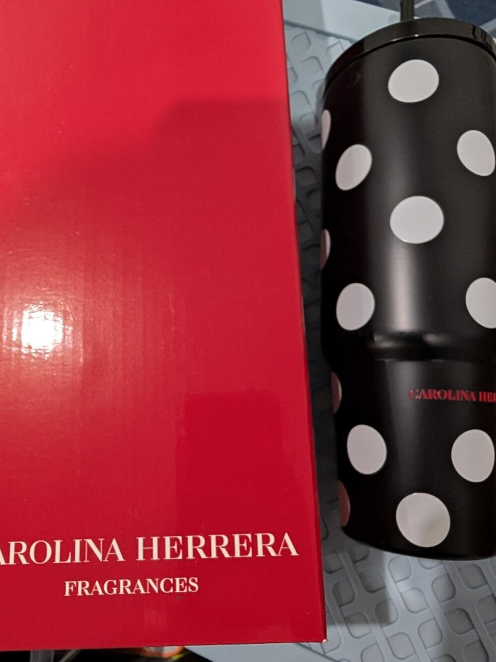 Carolina Herrera black polka dot water bottle drink holder beverage holder